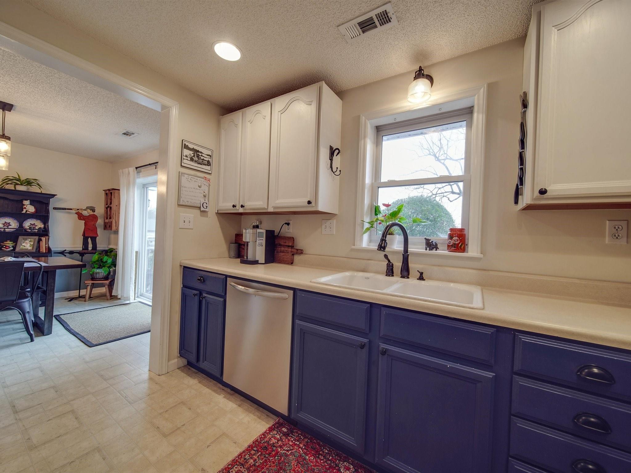 3410 Helms Pond Road Monroe, NC 28110 - Photo 24 of 35 a kitchen with stainless steel appliances granite countertop a sink dishwasher stove and cabinets
