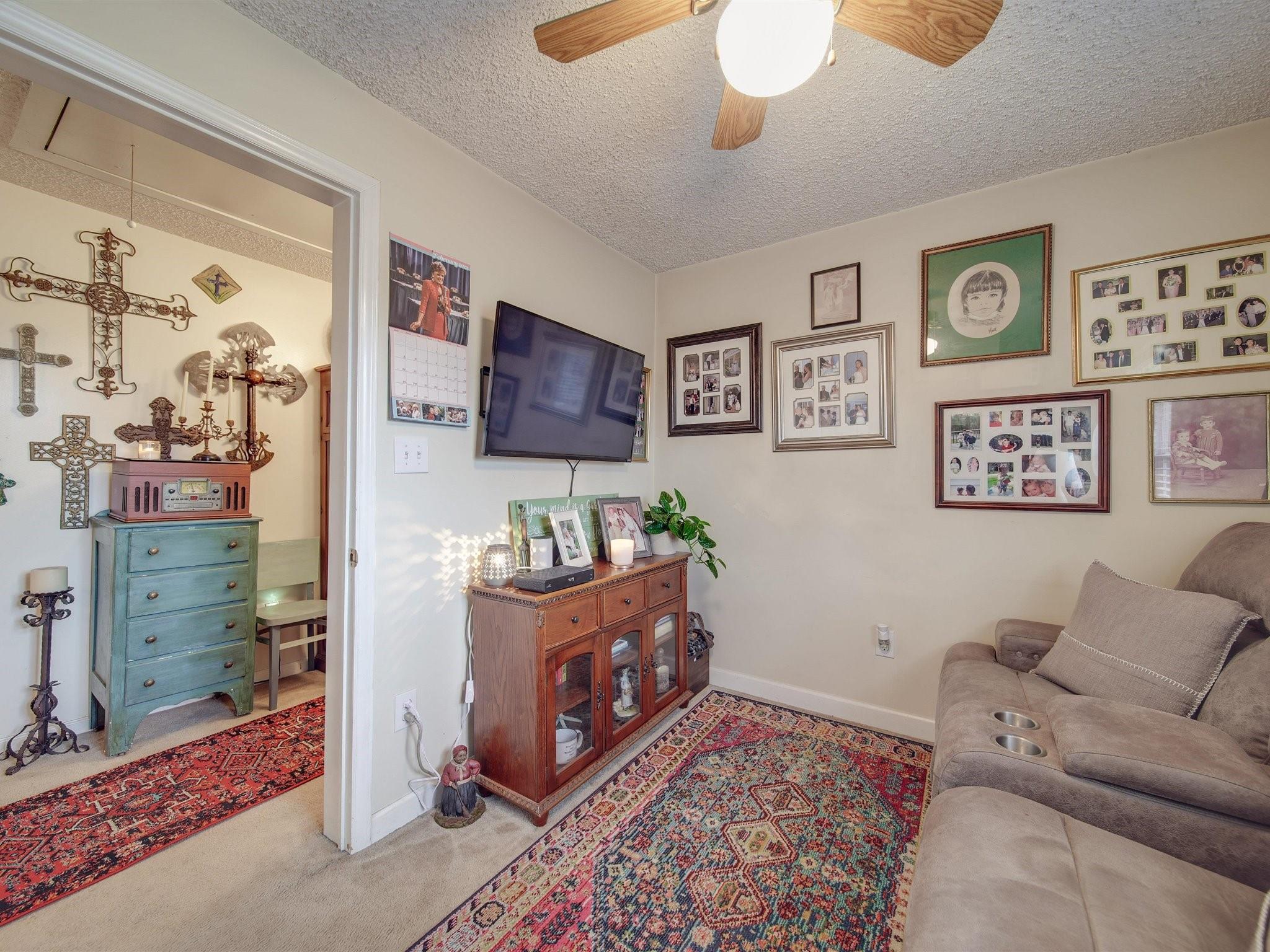 3410 Helms Pond Road Monroe, NC 28110 - Photo 30 of 35 a living room with furniture and a flat screen tv