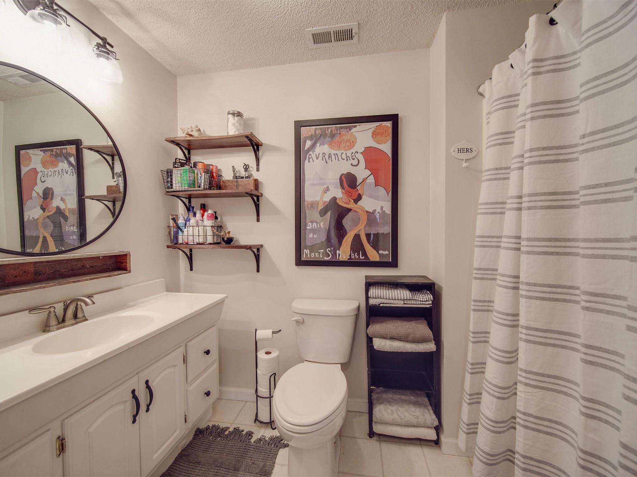 3410 Helms Pond Road Monroe, NC 28110 - Photo 32 of 35 a bathroom with a toilet a sink and a mirror