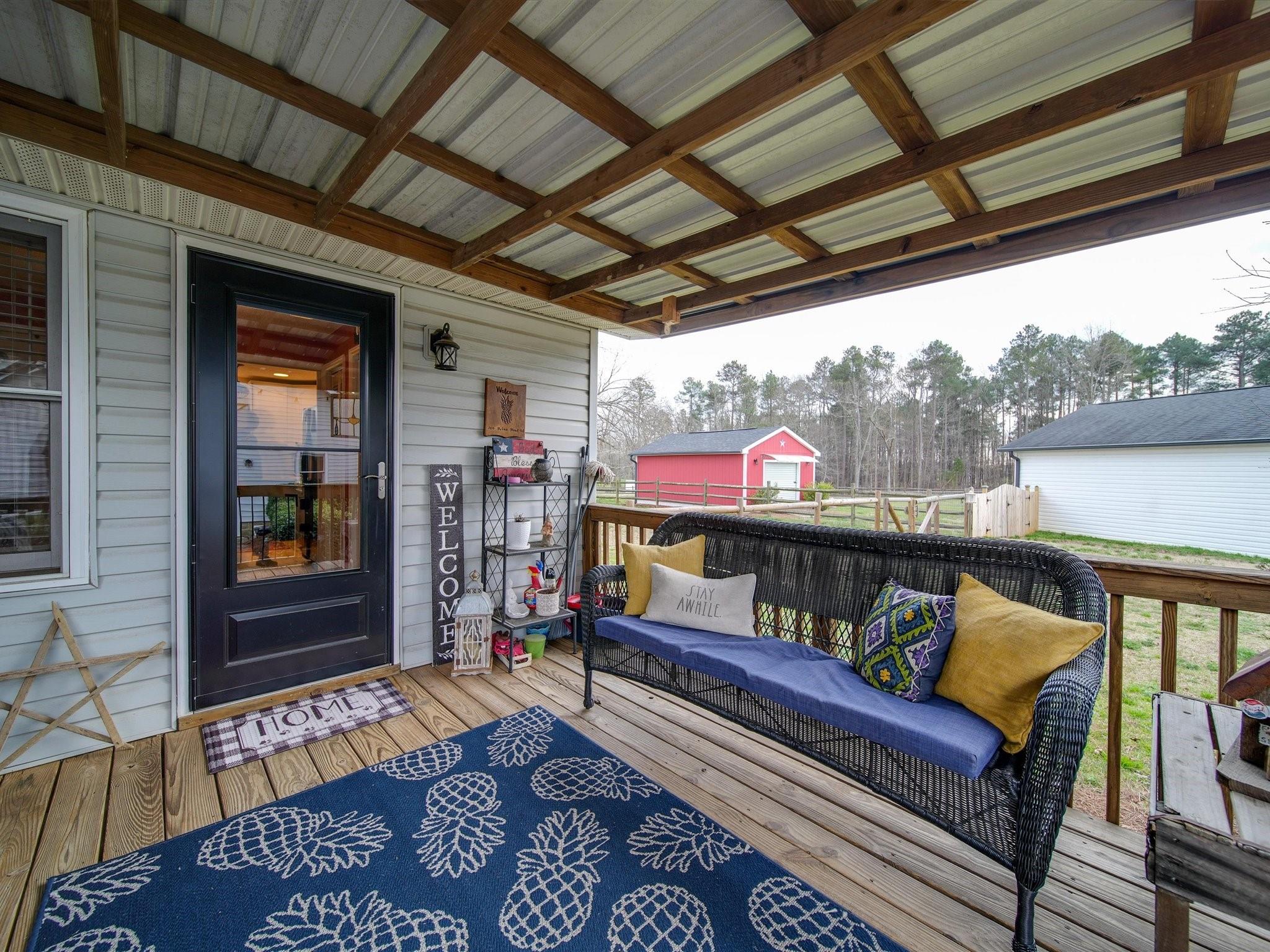3410 Helms Pond Road Monroe, NC 28110 - Photo 4 of 35 a view of a chairs in the balcony