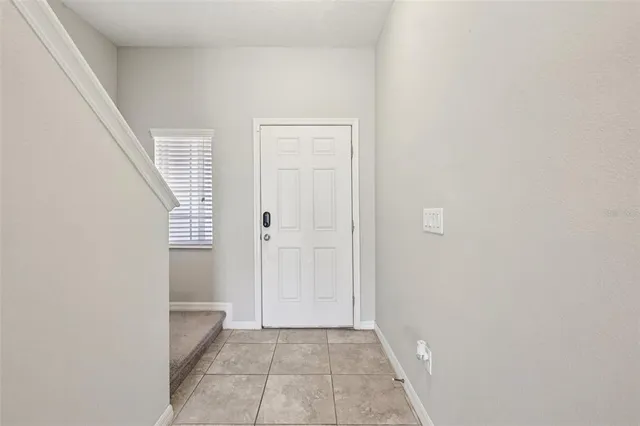 a view of an empty room with windows