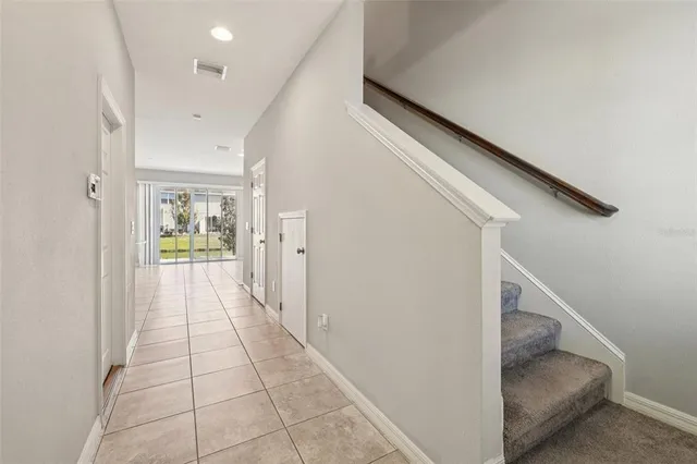 a view of a hallway view with staircase