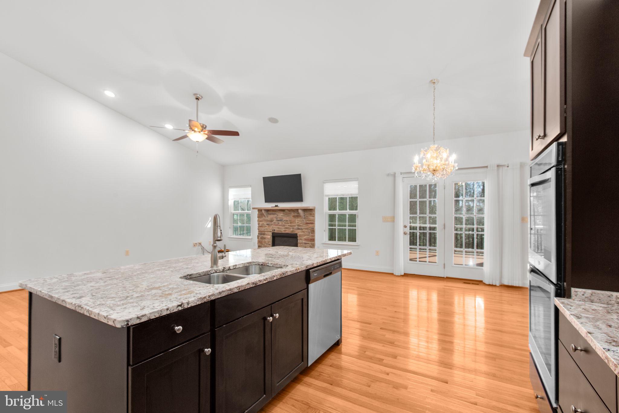 400 Telegraph Road Stafford, VA 22554 - Photo 12 of 79 a kitchen with a sink cabinets and wooden floor