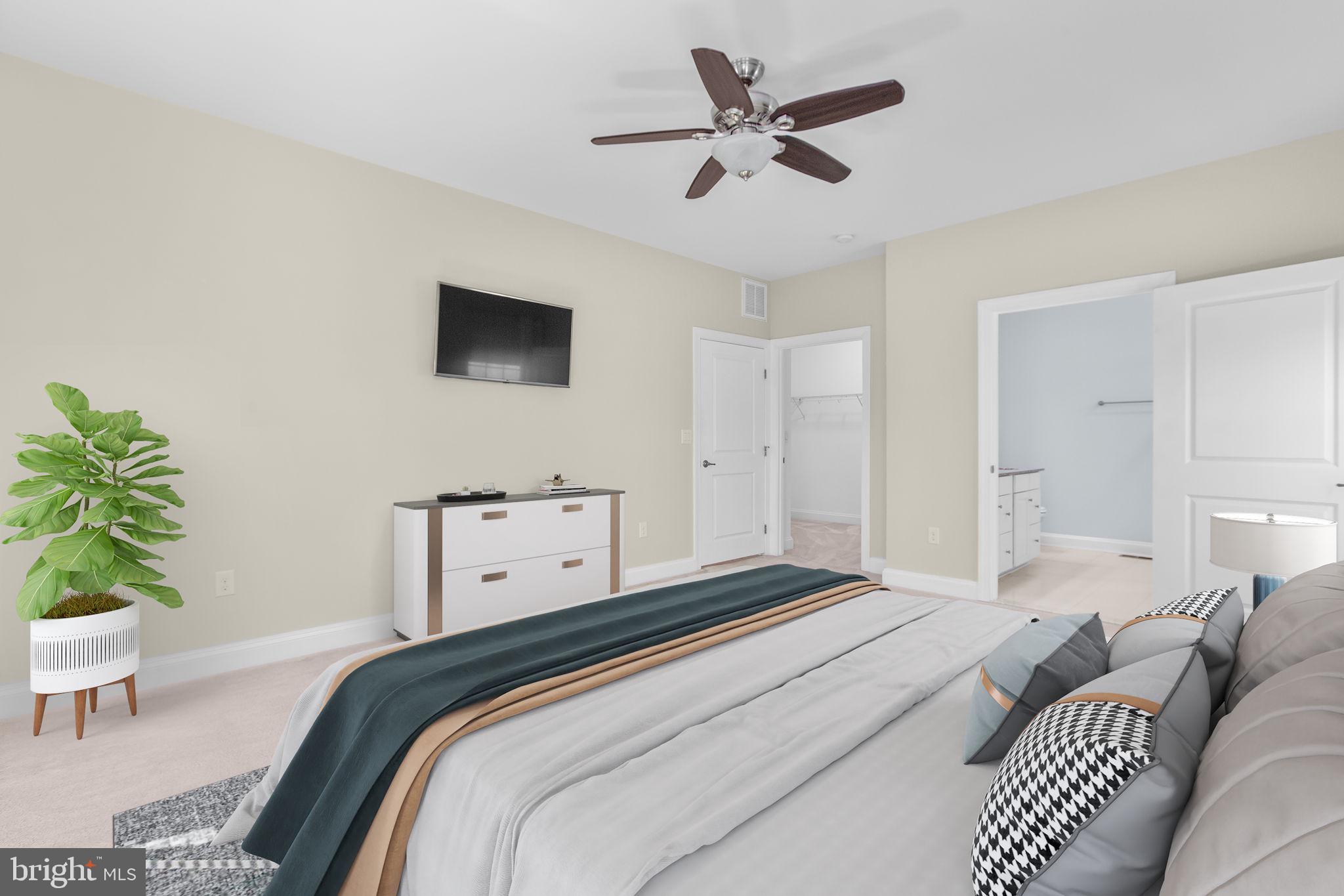 400 Telegraph Road Stafford, VA 22554 - Photo 18 of 79 a bedroom with a bed and a potted plant