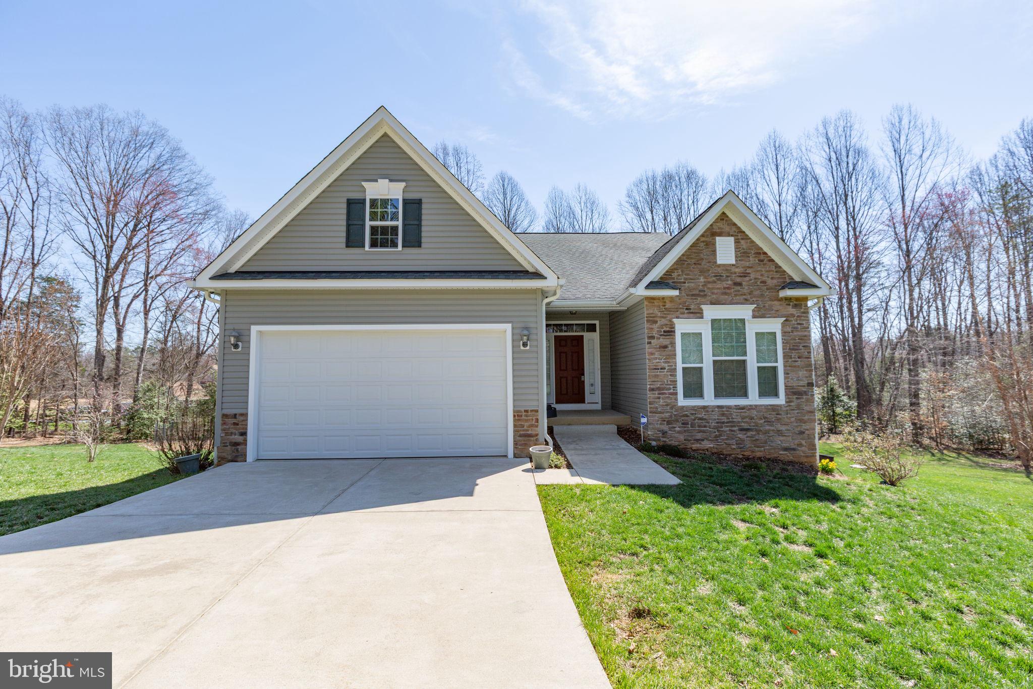 400 Telegraph Road Stafford, VA 22554 - Photo 3 of 79 a front view of a house with a yard and garage