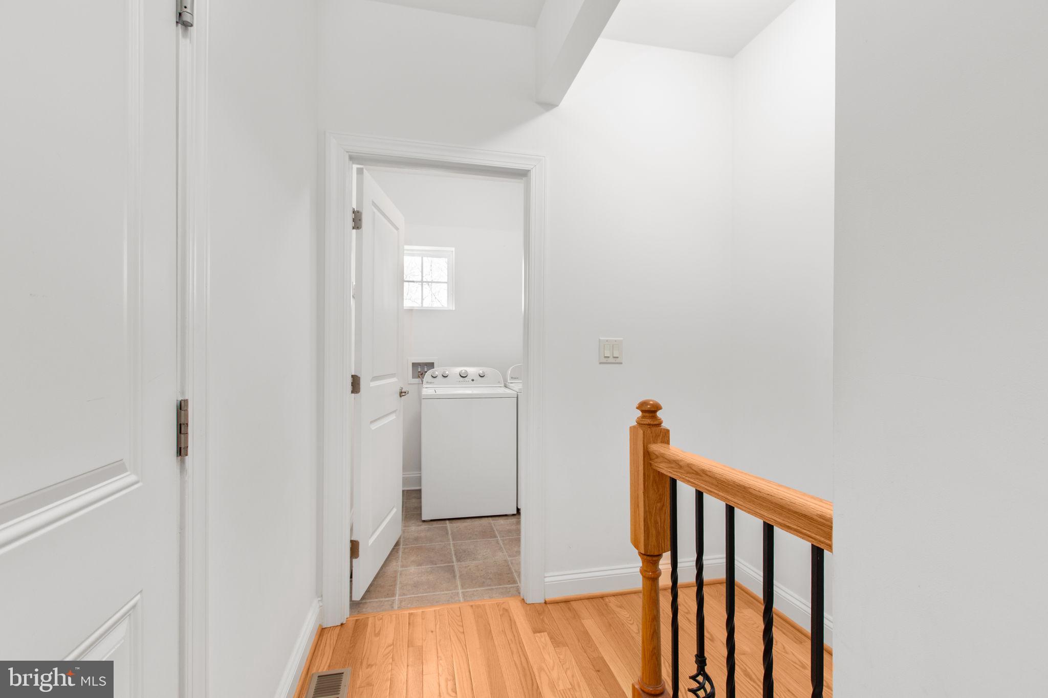 400 Telegraph Road Stafford, VA 22554 - Photo 35 of 79 a view of a hallway with wooden floor and staircase