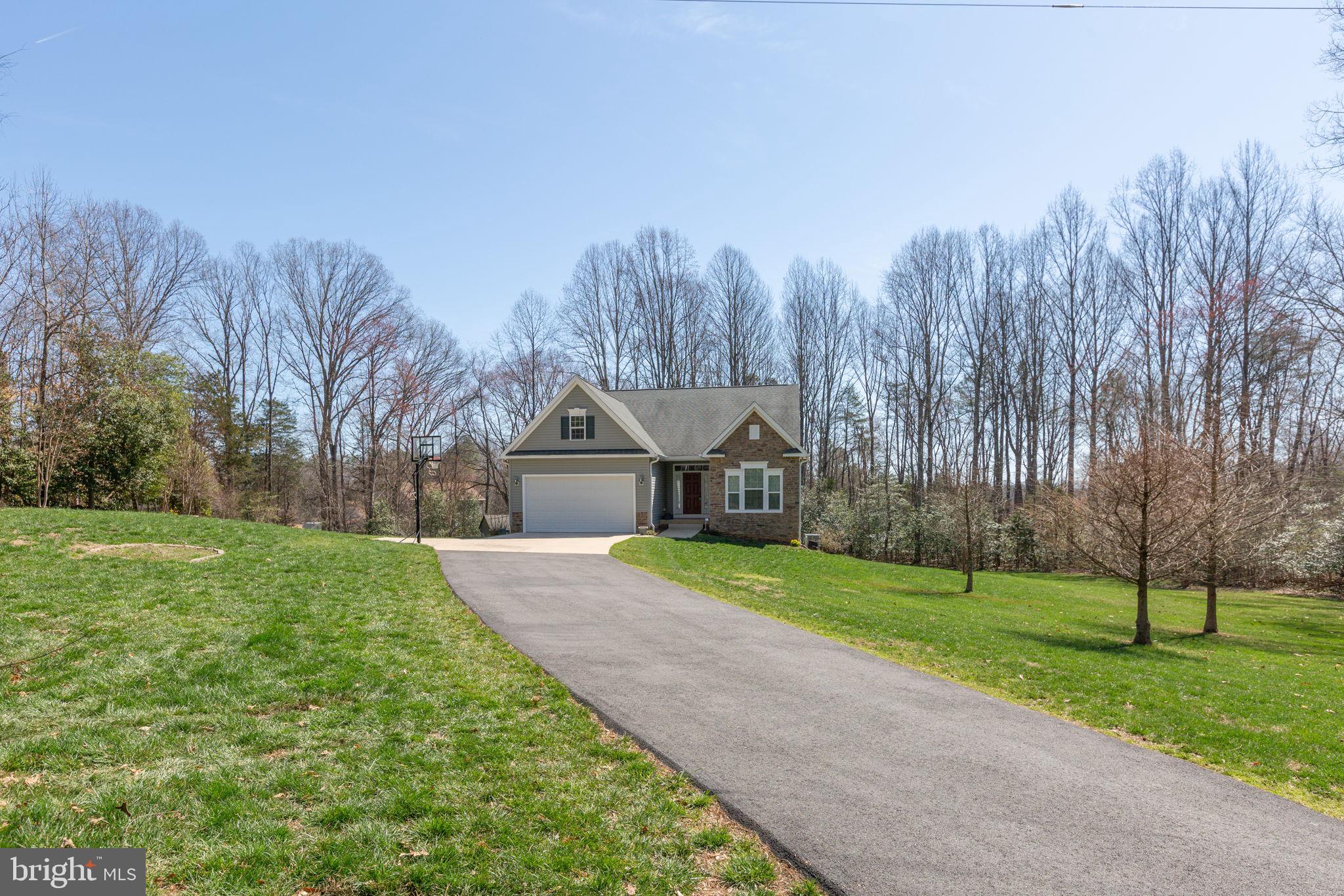 400 Telegraph Road Stafford, VA 22554 - Photo 38 of 79 a front view of a house with a yard and trees