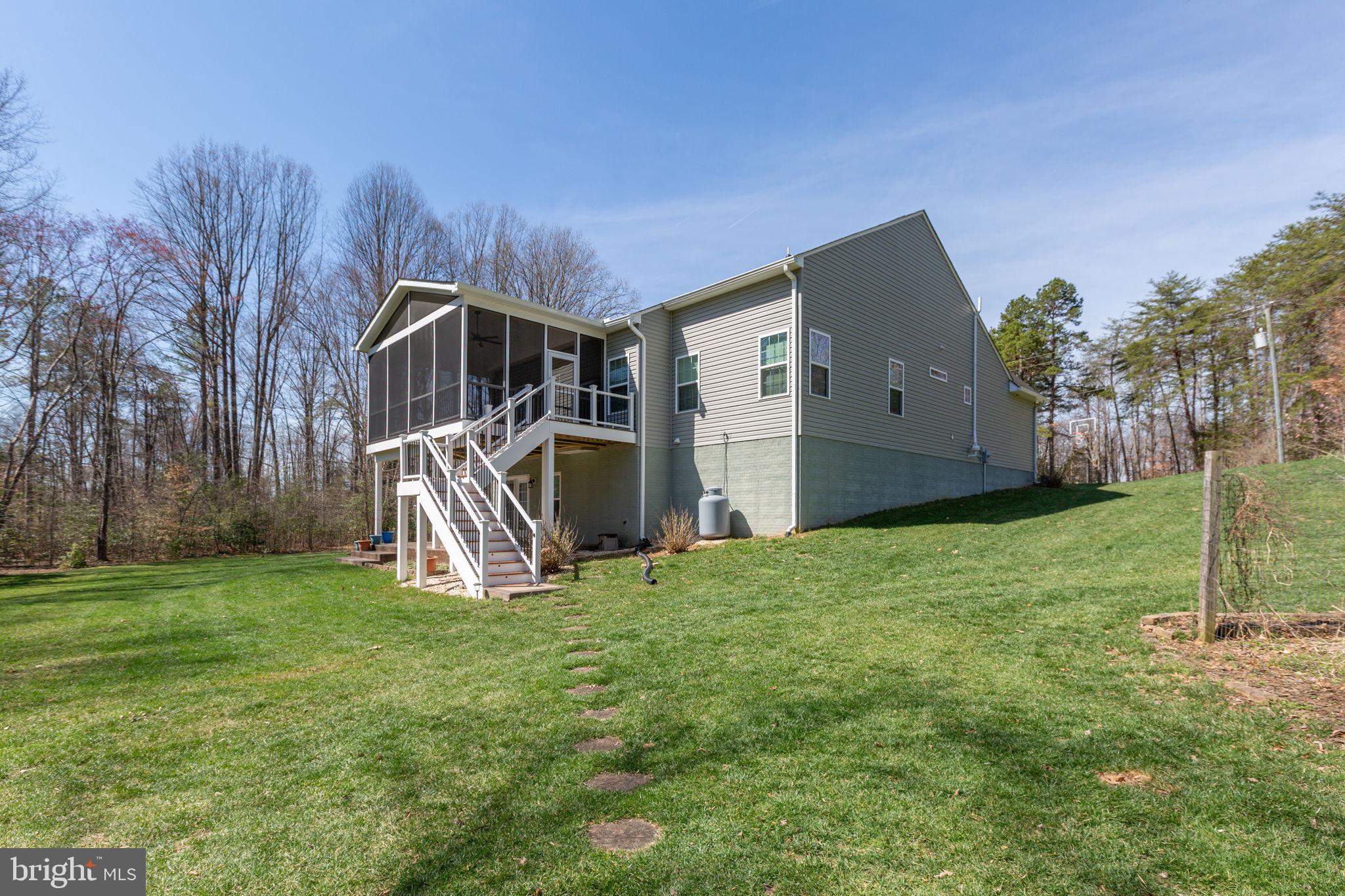400 Telegraph Road Stafford, VA 22554 - Photo 44 of 79 a view of a house with backyard and a tree