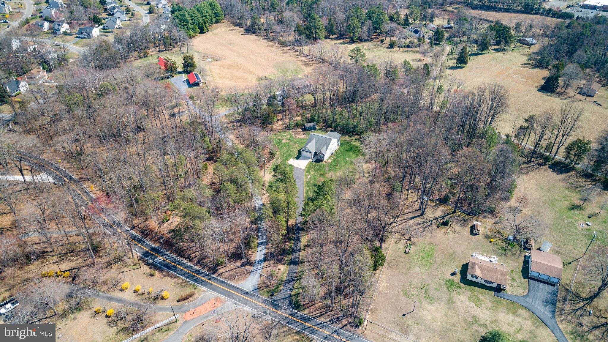 400 Telegraph Road Stafford, VA 22554 - Photo 69 of 79 a view of a wooden house with a yard