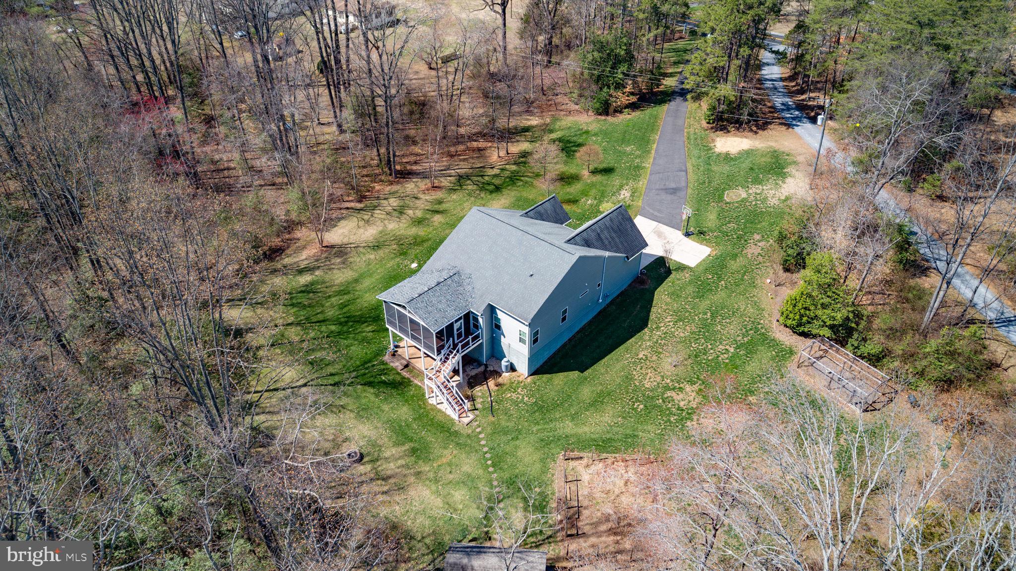 400 Telegraph Road Stafford, VA 22554 - Photo 79 of 79 an aerial view of a house with a yard and large trees
