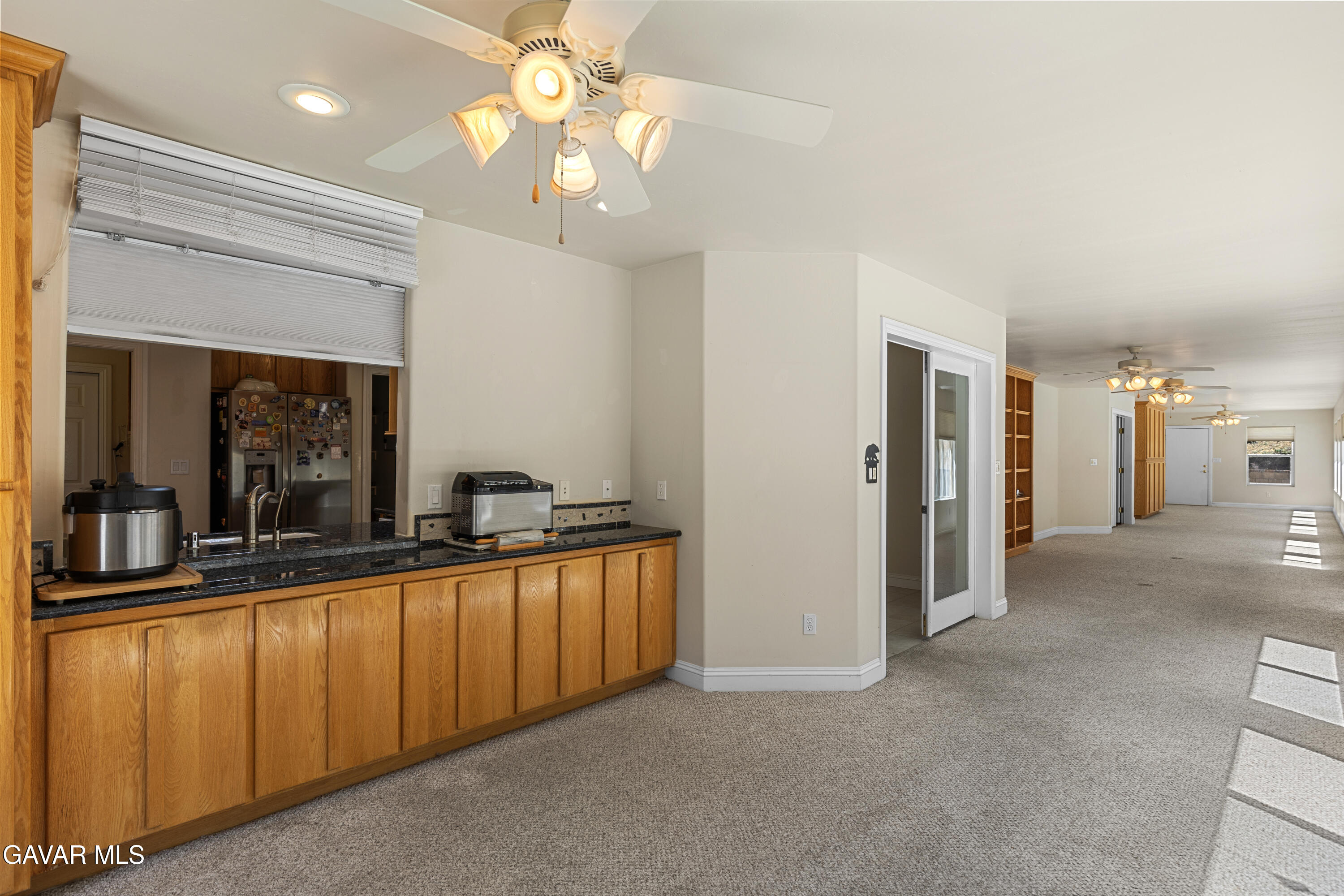 30100 Sunland Way Tehachapi, CA 93561 - Photo 15 of 44 a view of a kitchen with a sink and a chandelier fan