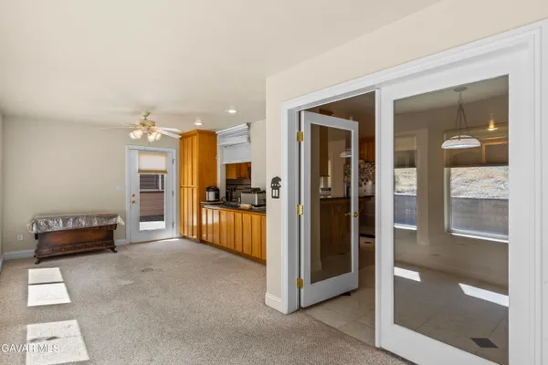 a living room with furniture and a walk in closet