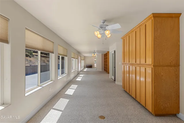 a view of a hallway with windows