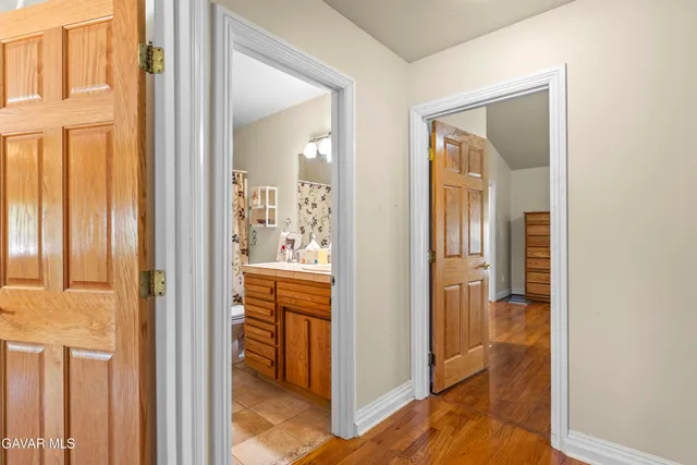 a view of a bathroom from a hallway