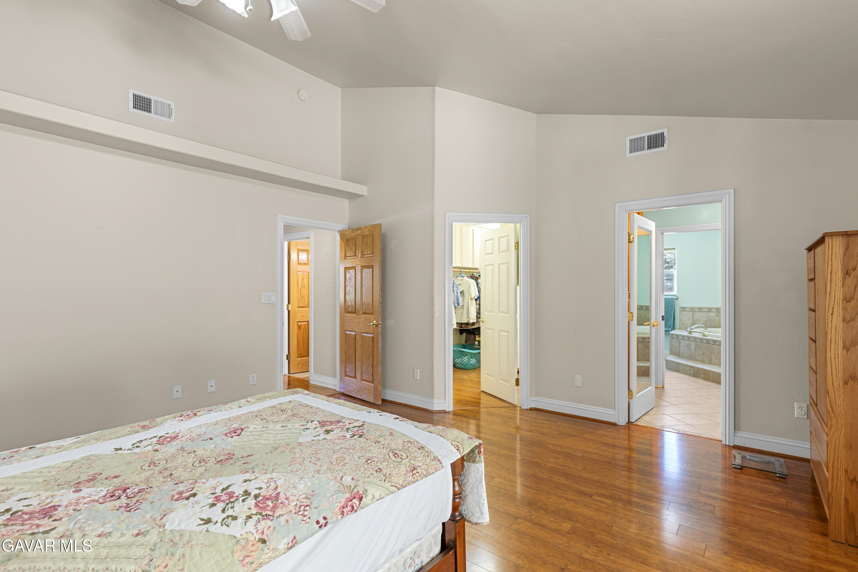 30100 Sunland Way Tehachapi, CA 93561 - Photo 27 of 44 a view of a bedroom with wooden floor and bathroom