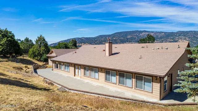 a view of a house with a terrace