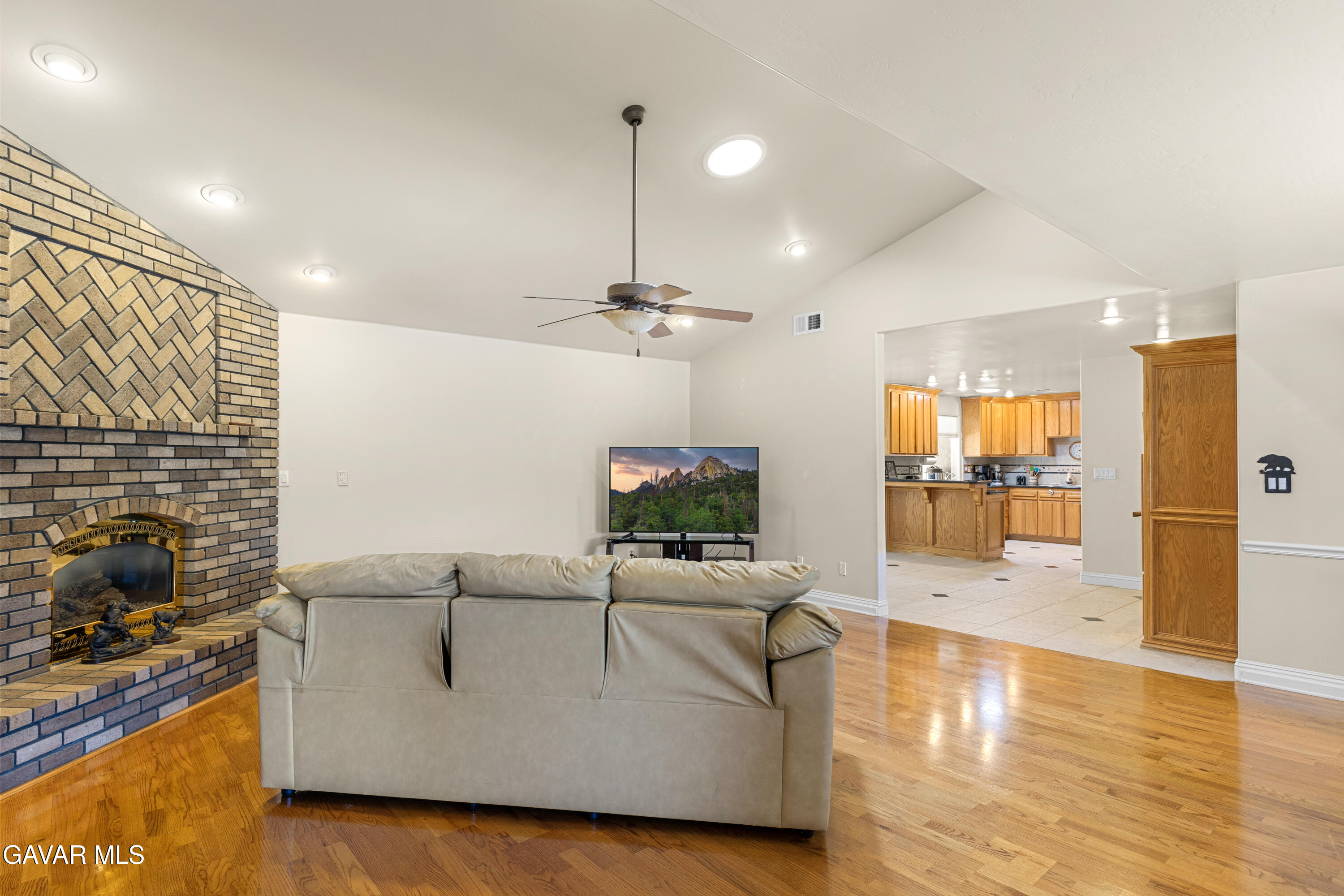 30100 Sunland Way Tehachapi, CA 93561 - Photo 5 of 44 a living room with furniture wooden floor and a fireplace