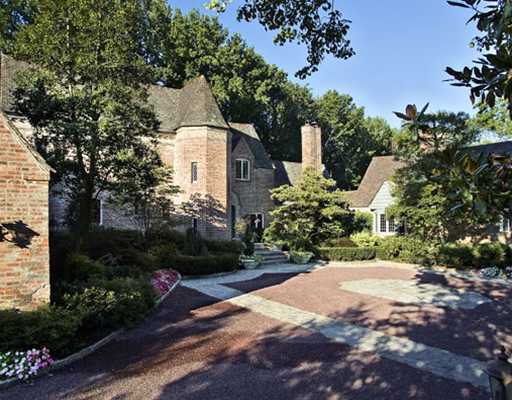 Undisclosed Address Greenwich, CT 06830 - Photo 2 of 10 a front view of a house with a yard and outdoor seating