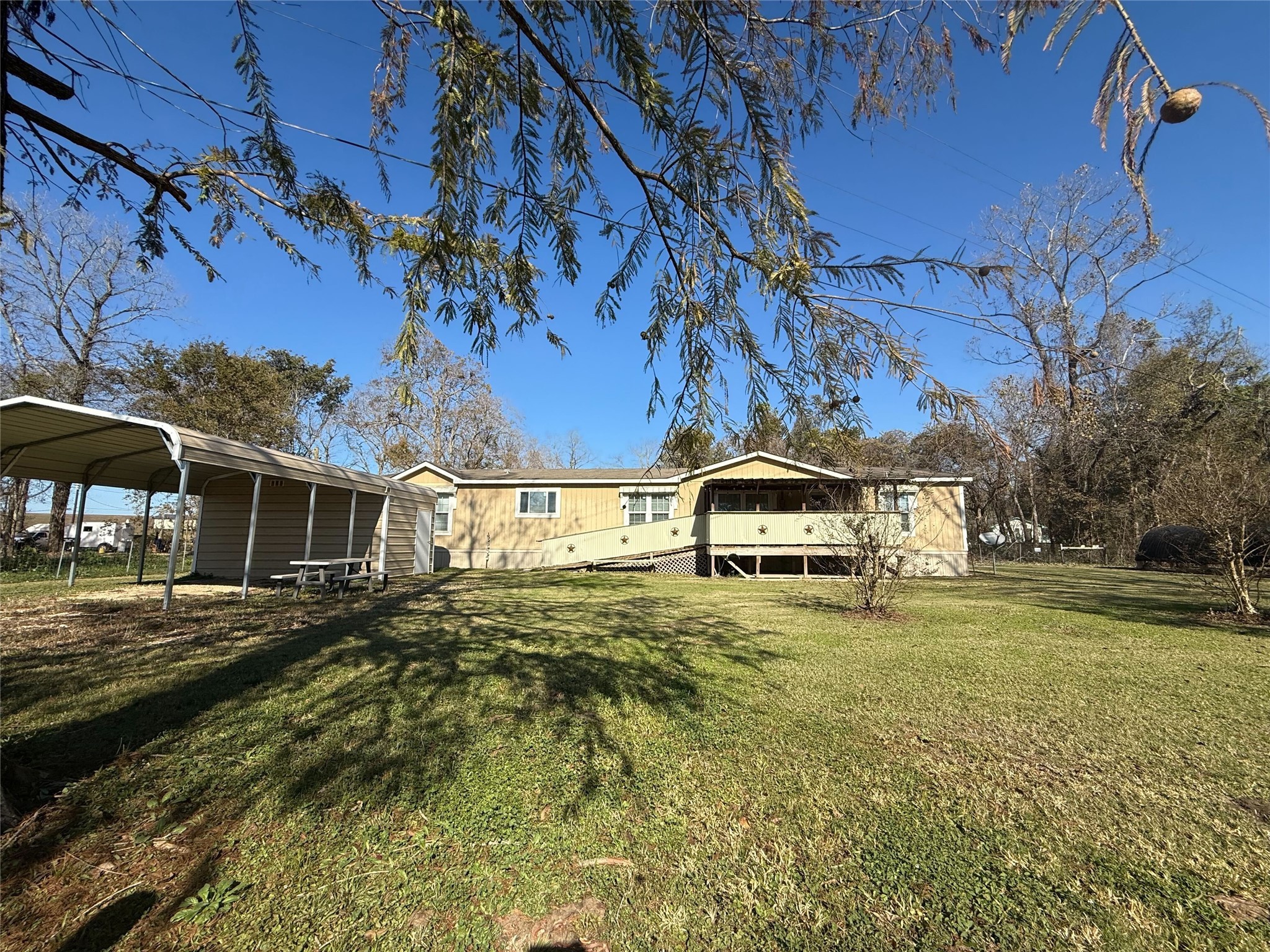 181 Janning Street Coldspring, TX 77331 - Photo 1 of 49 a front view of a house with a yard