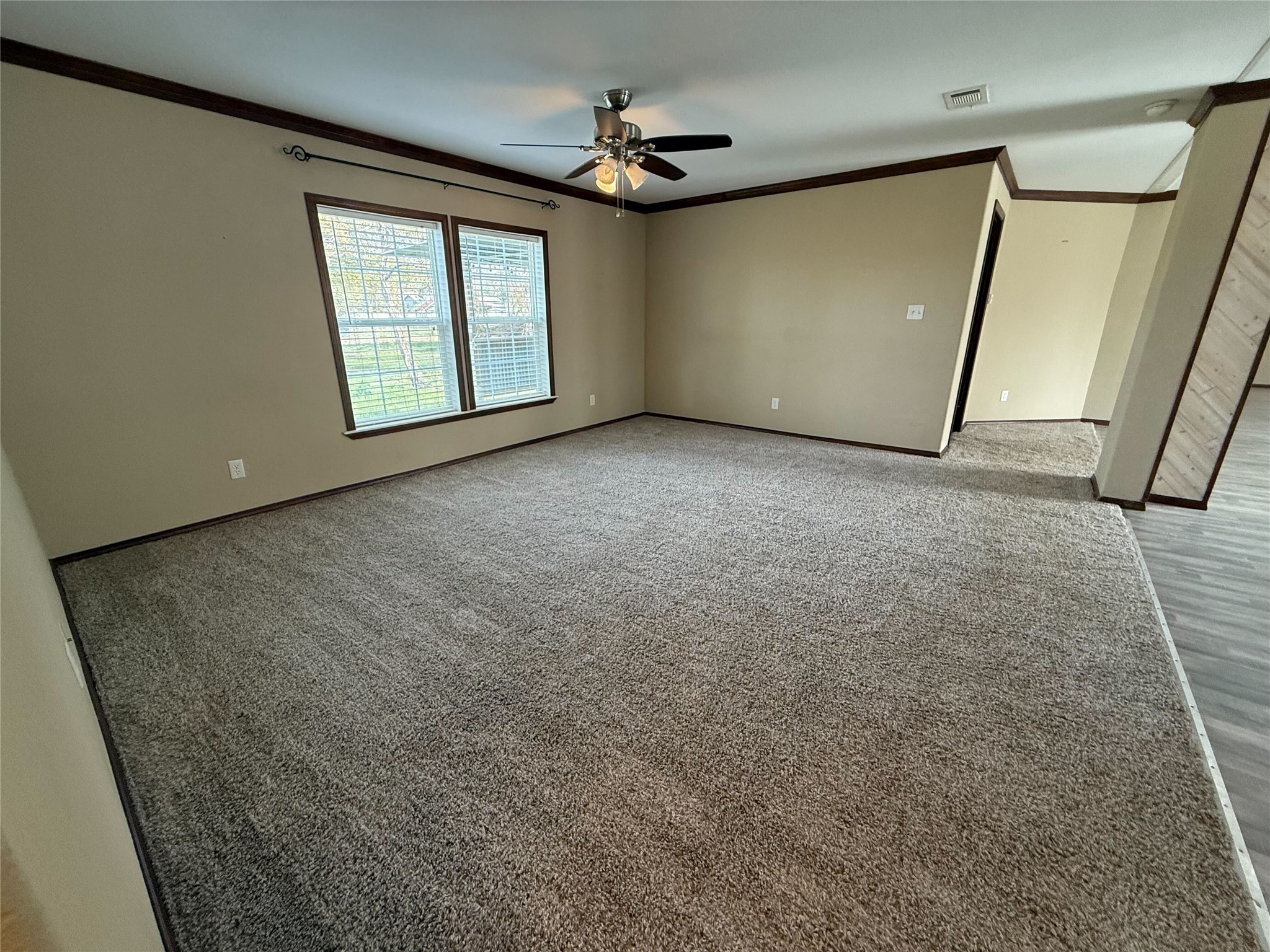 181 Janning Street Coldspring, TX 77331 - Photo 14 of 49 an empty room with windows and entrance