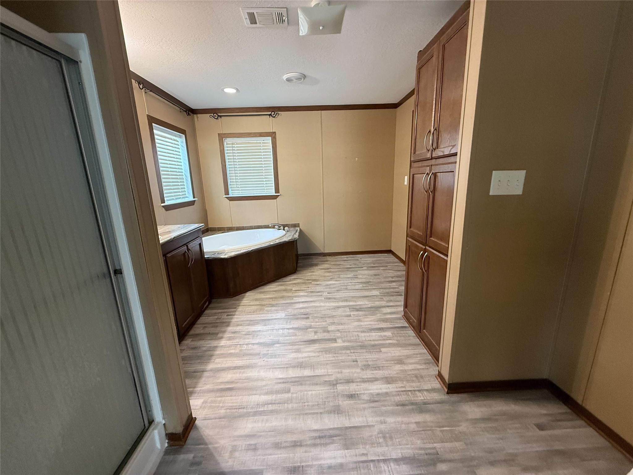 181 Janning Street Coldspring, TX 77331 - Photo 15 of 49 a view of a hallway with wooden floor and staircase
