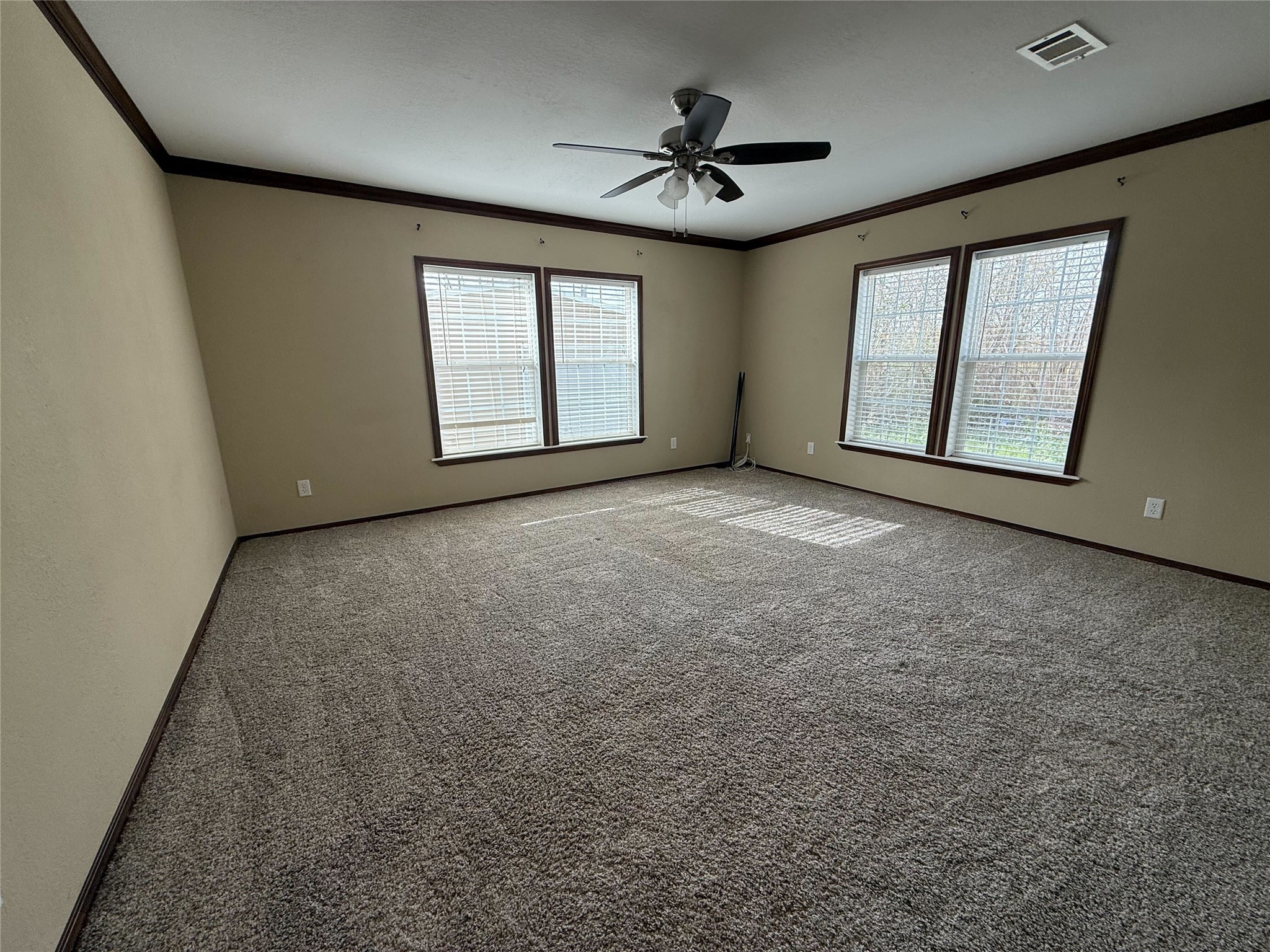 181 Janning Street Coldspring, TX 77331 - Photo 16 of 49 a view of an empty room with windows