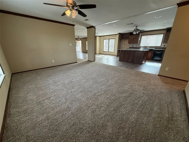 a spacious bathroom with a double vanity sink and a mirror