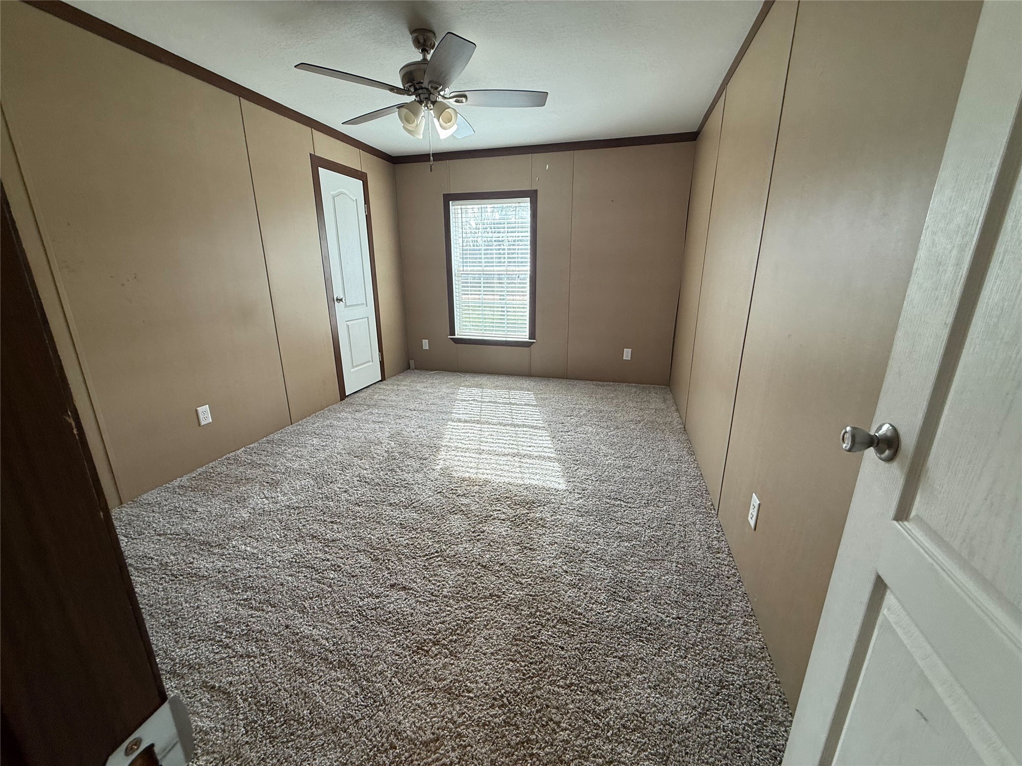 181 Janning Street Coldspring, TX 77331 - Photo 27 of 49 wooden floor in an empty room with a bathroom