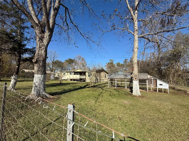 a view of a swimming pool with a yard