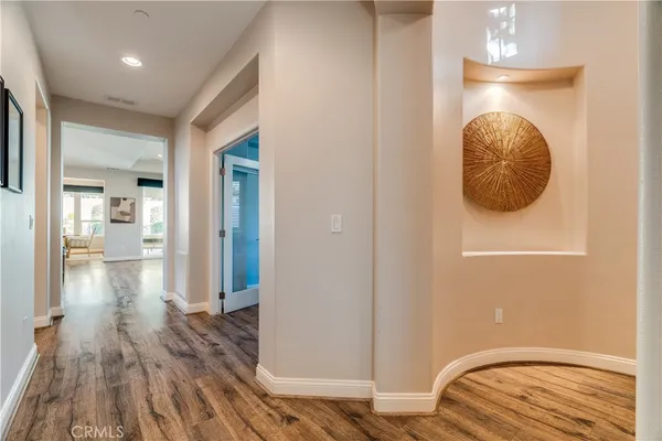 a kitchen with a sink cabinets and wooden floor