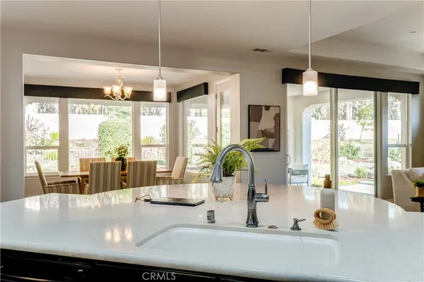 a spacious bathroom with a granite countertop tub sink shower and mirror
