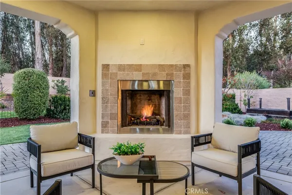 a view of a house with backyard sitting area and garden