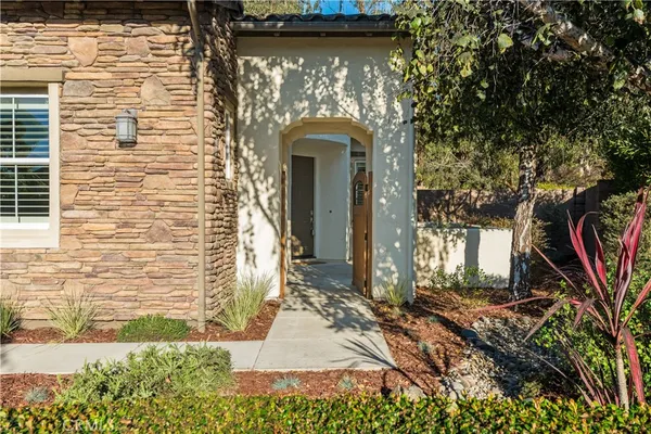a view of a house with sitting area and swimming pool