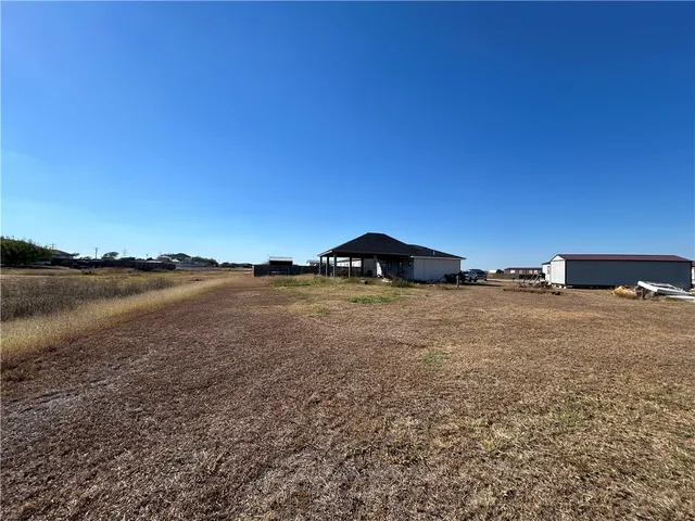 a house with trees in the background