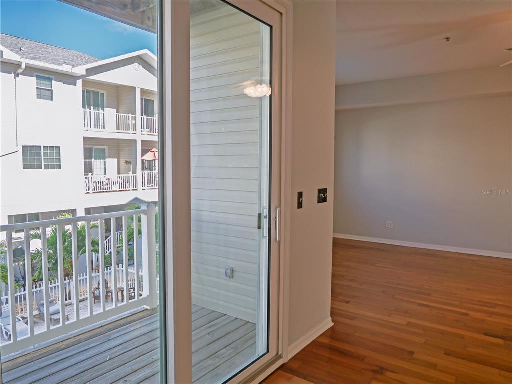 15473 Gulf Boulevard Madeira Beach, FL 33708 - Photo 11 of 41 a view of balcony with wooden floor