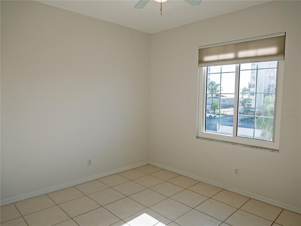 15473 Gulf Boulevard Madeira Beach, FL 33708 - Photo 15 of 41 an empty room with a window