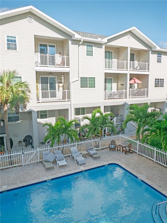 15473 Gulf Boulevard Madeira Beach, FL 33708 - Photo 18 of 41 a house view with a seating space and a garden