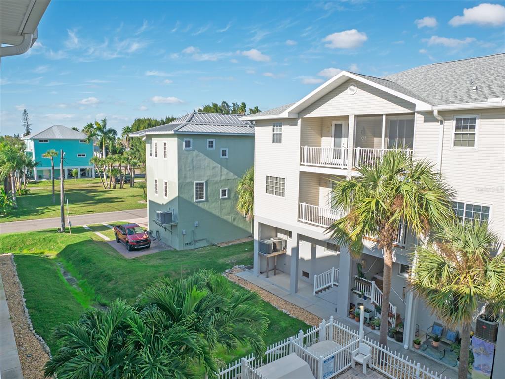 15473 Gulf Boulevard Madeira Beach, FL 33708 - Photo 19 of 41 a front view of a house with garden