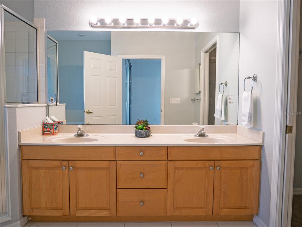 15473 Gulf Boulevard Madeira Beach, FL 33708 - Photo 20 of 41 a bathroom with a sink and a mirror