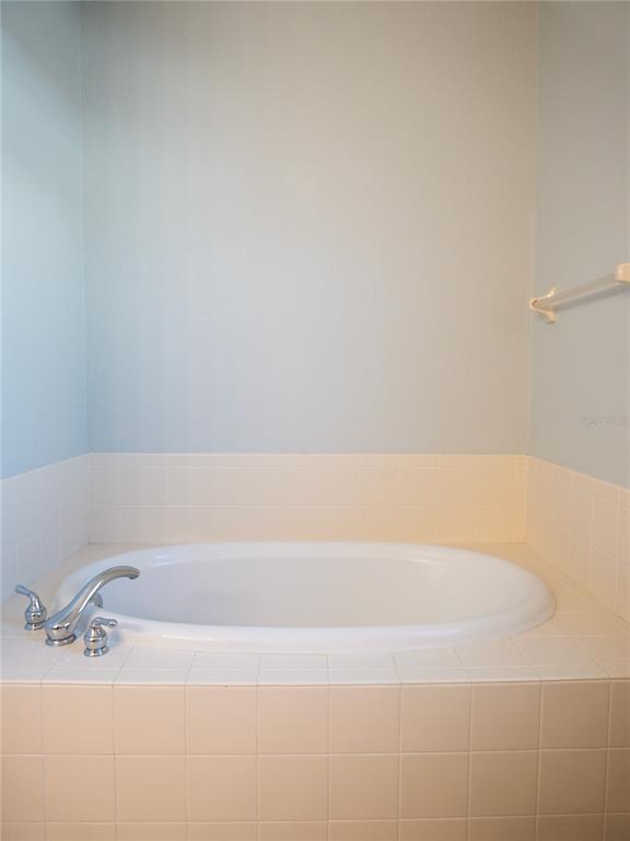 15473 Gulf Boulevard Madeira Beach, FL 33708 - Photo 21 of 41 a bathroom with a bathtub