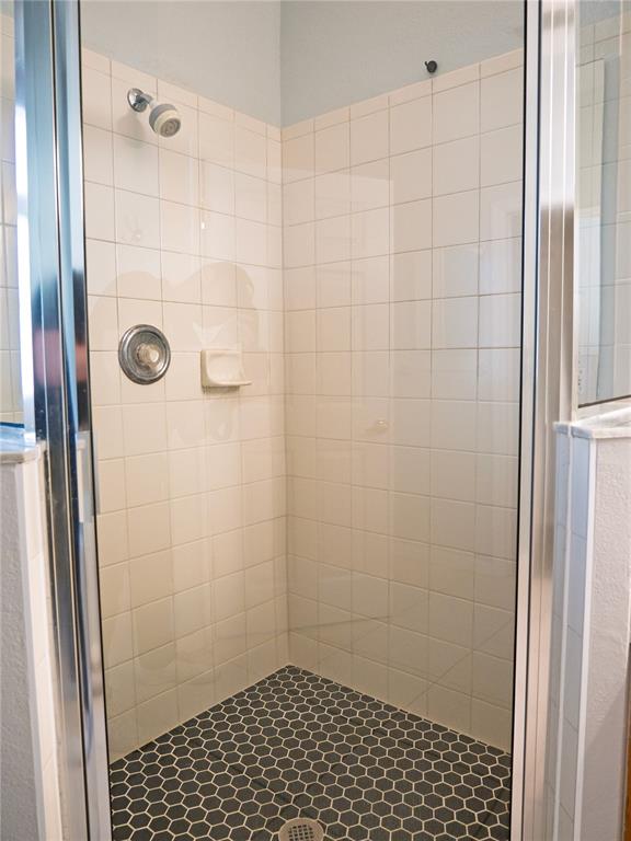 15473 Gulf Boulevard Madeira Beach, FL 33708 - Photo 22 of 41 a bathroom with a shower