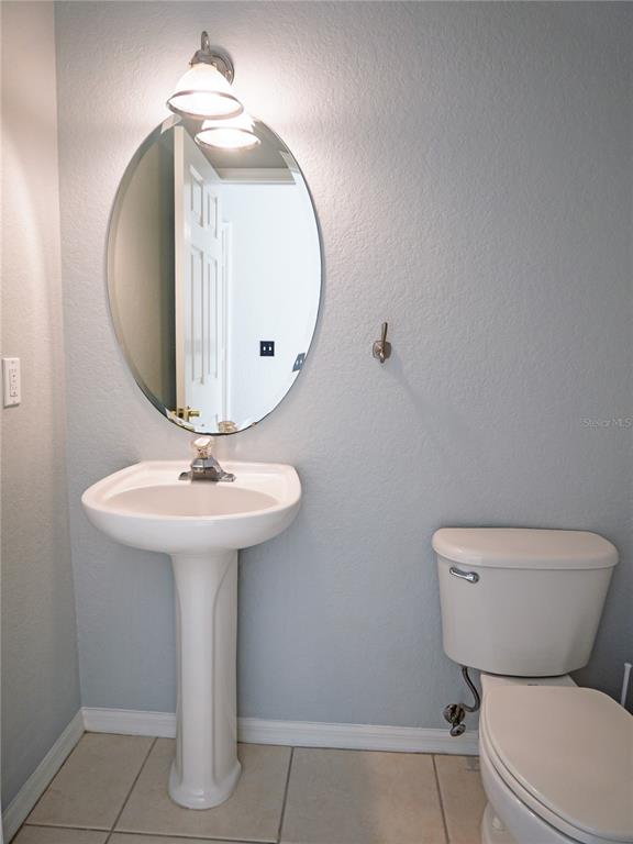15473 Gulf Boulevard Madeira Beach, FL 33708 - Photo 30 of 40 a bathroom with a toilet sink and mirror