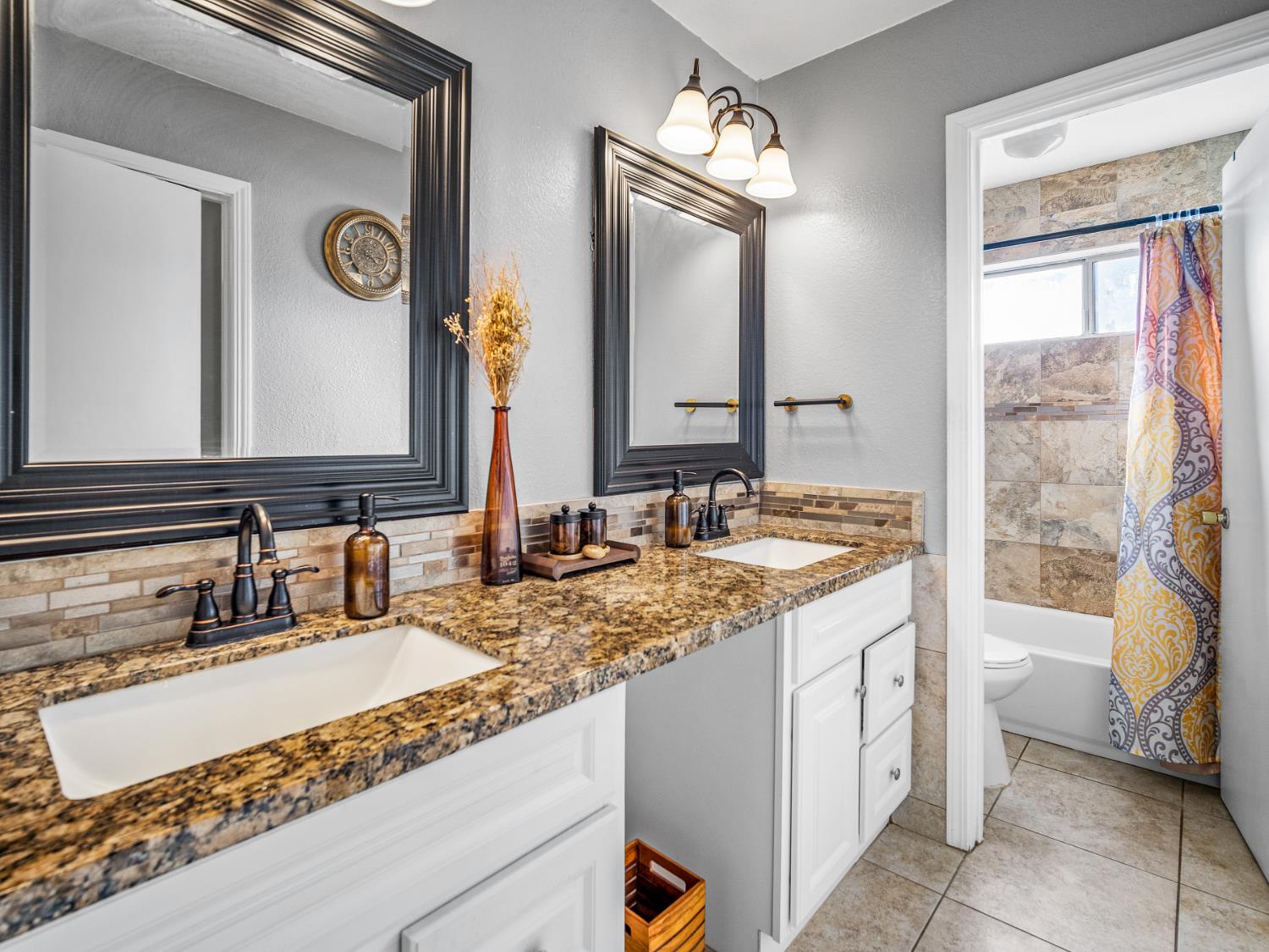 5324 Garfield Avenue, Unit 3 Sacramento, CA 95841 - Photo 14 of 17 a bathroom with a sink and a mirror