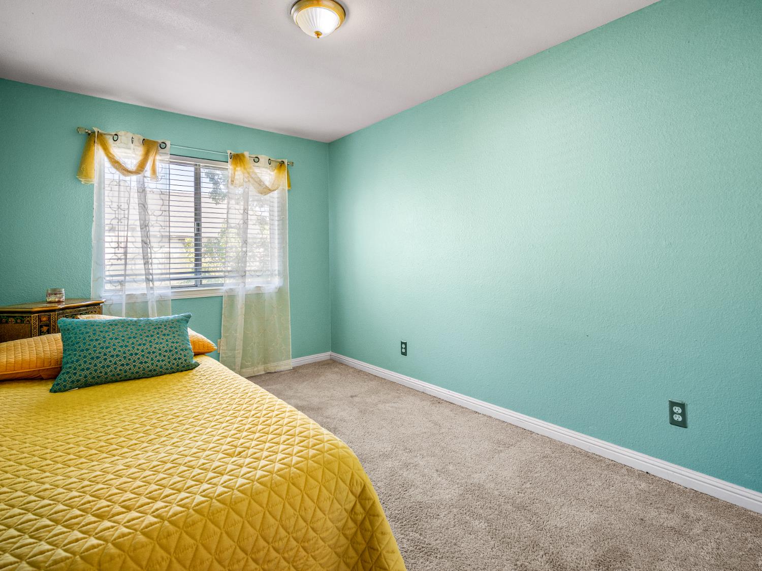 5324 Garfield Avenue, Unit 3 Sacramento, CA 95841 - Photo 16 of 17 a bedroom with a bed and a window