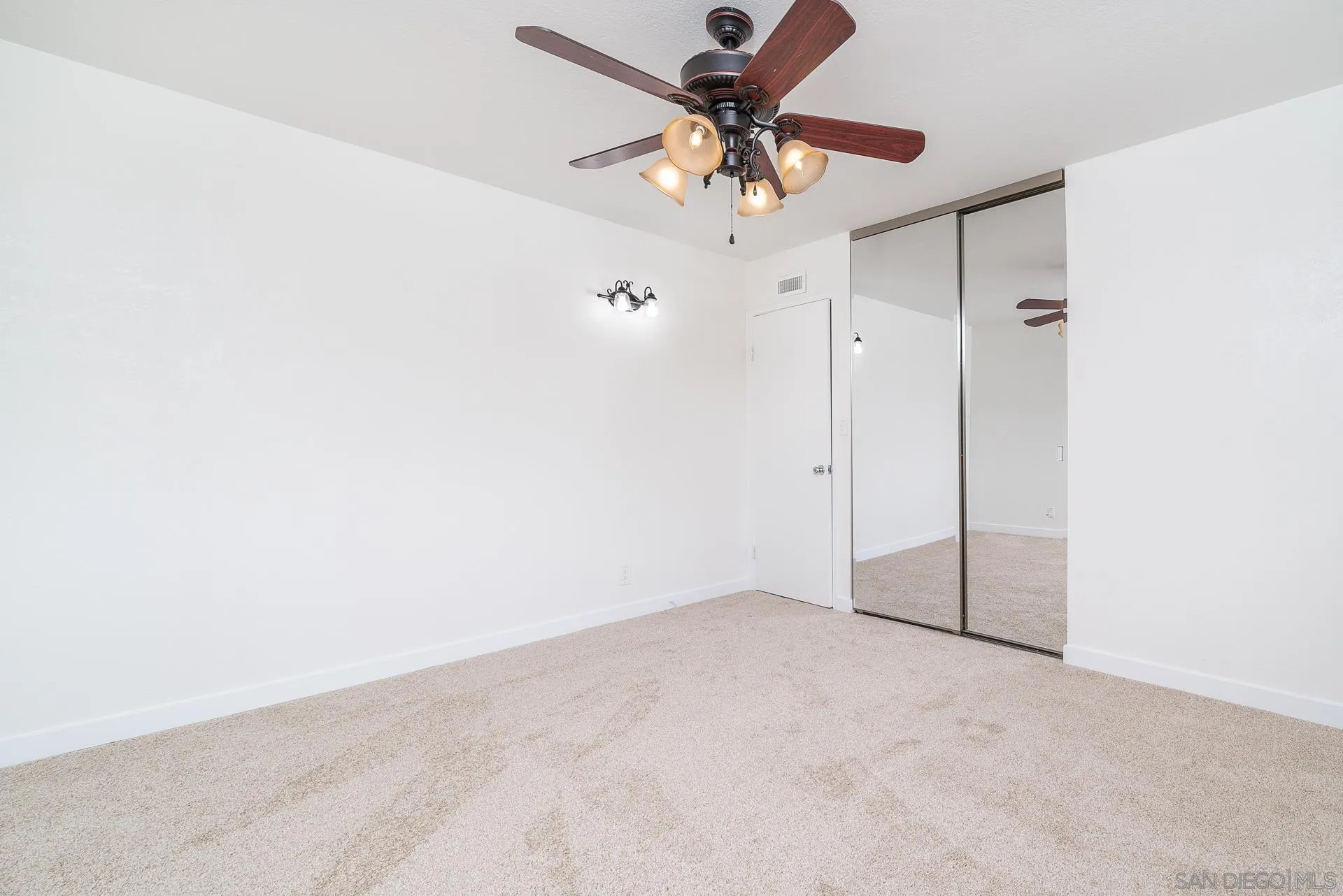 4047 Thomas Street Oceanside, CA 92056 - Photo 13 of 21 an empty room with a fan & a ceiling fan