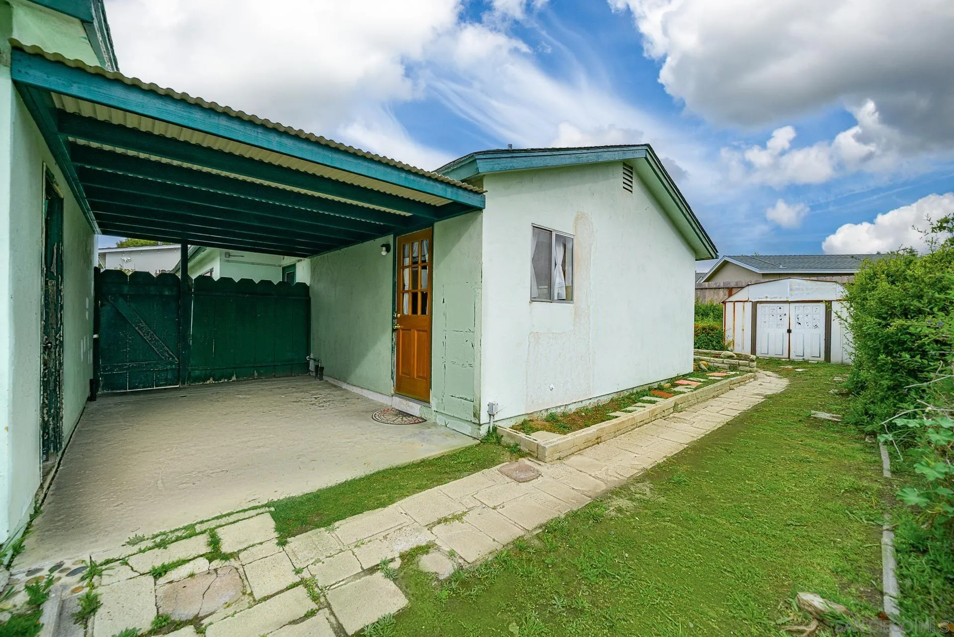 4047 Thomas Street Oceanside, CA 92056 - Photo 17 of 21 a backyard of a house with yard and trampoline