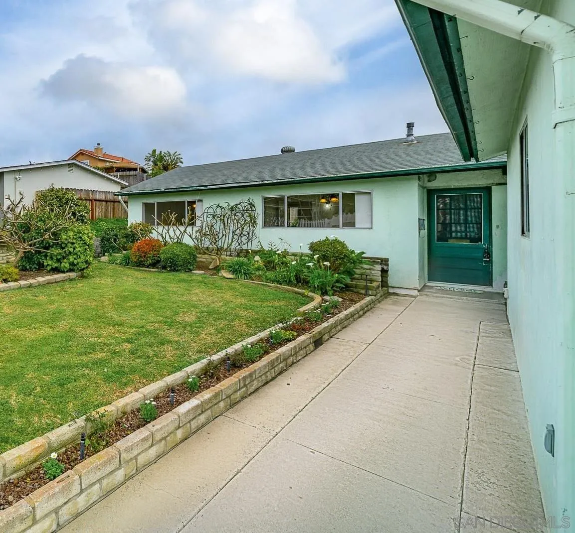 4047 Thomas Street Oceanside, CA 92056 - Photo 3 of 21 a front view of a house with garden