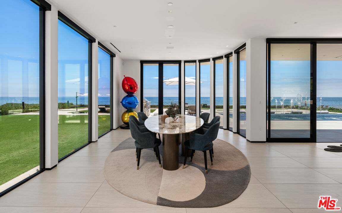 31100 Broad Beach Road Malibu, CA 90265 - Photo 11 of 38 a dining room with furniture a floor to ceiling window and pool table