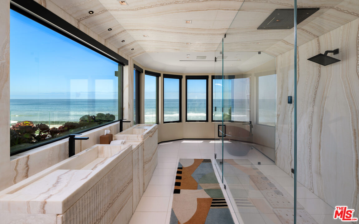 31100 Broad Beach Road Malibu, CA 90265 - Photo 18 of 38 a large white kitchen with a large window