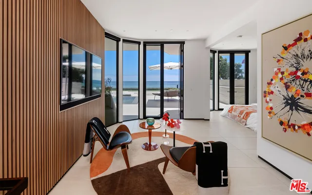 a bedroom with a bed and flat screen tv